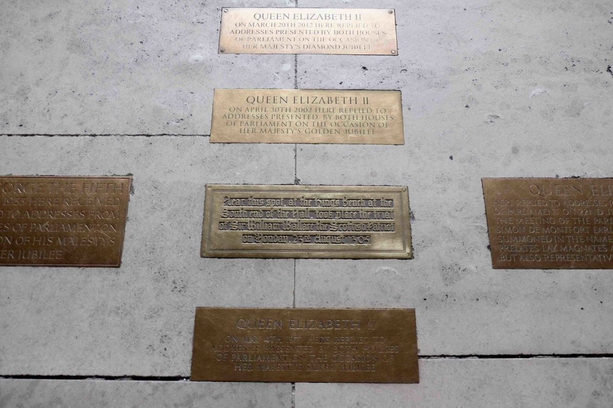 The Palace of westminster and parliament tour bronze plaque the queen stood here 