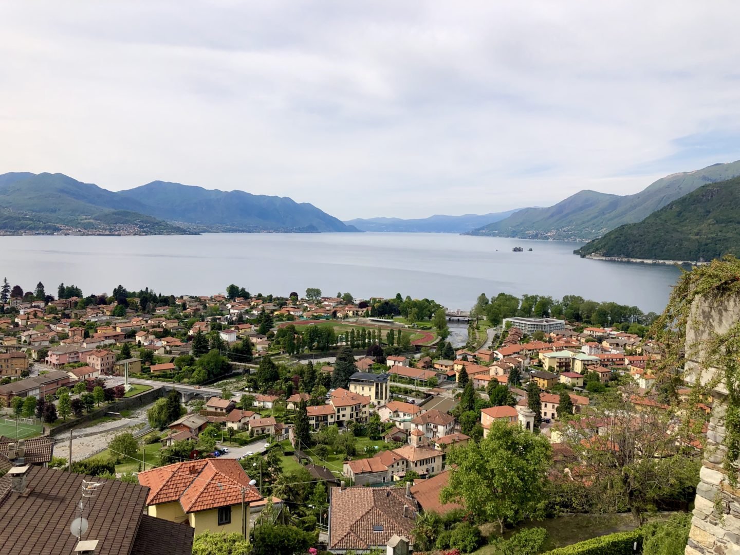 Maccagno town in Lake maggiore.  Its position on the bank of the river is remarkable if you stand on the shore of Maccagno you can see across the shore to the beautiful town of Cannibio and further down the down in to Switzerland and the town of Brissano.