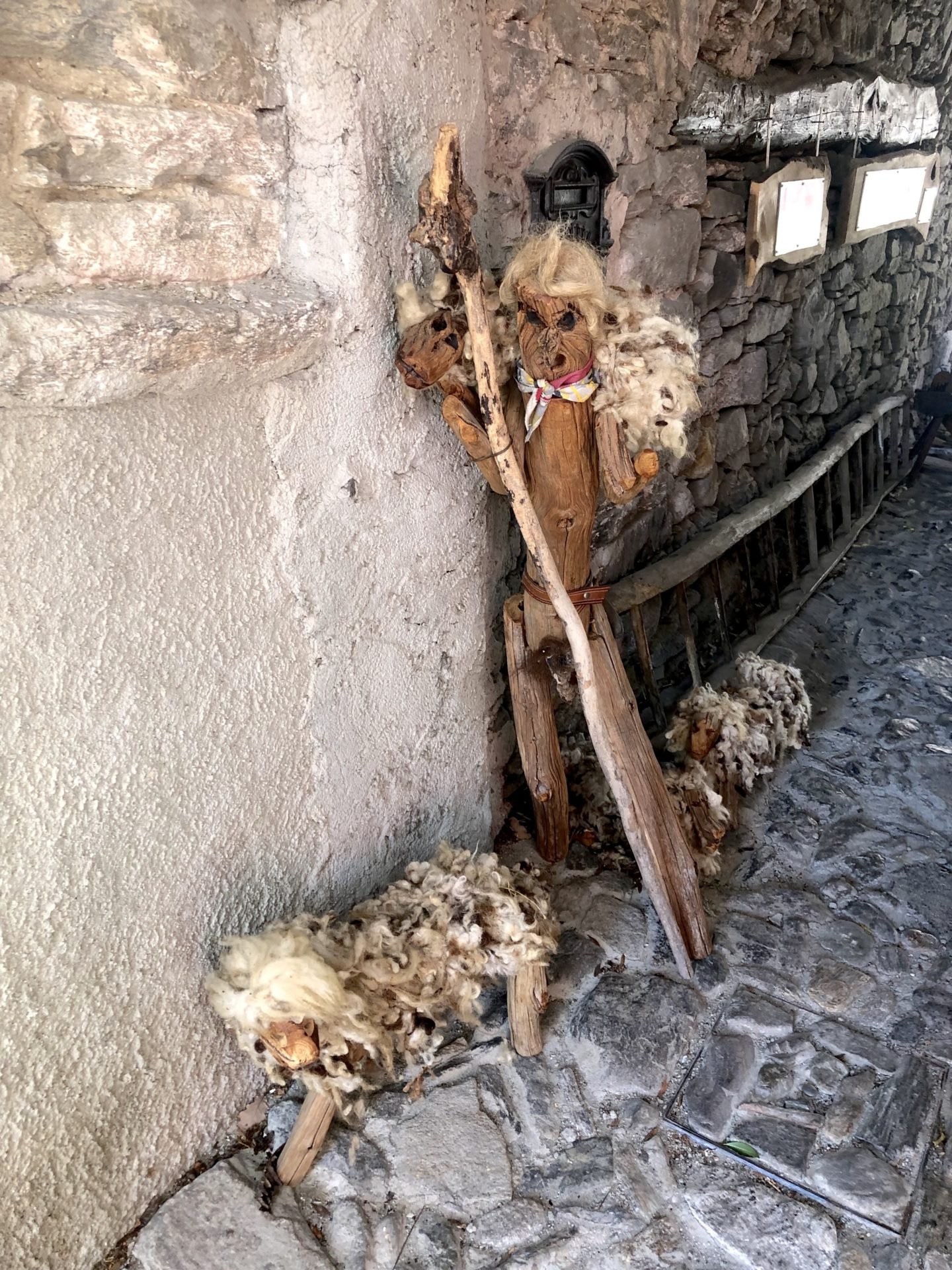 A shepard and sheep made out of wood in the town of Musignano, Lake Maggiore