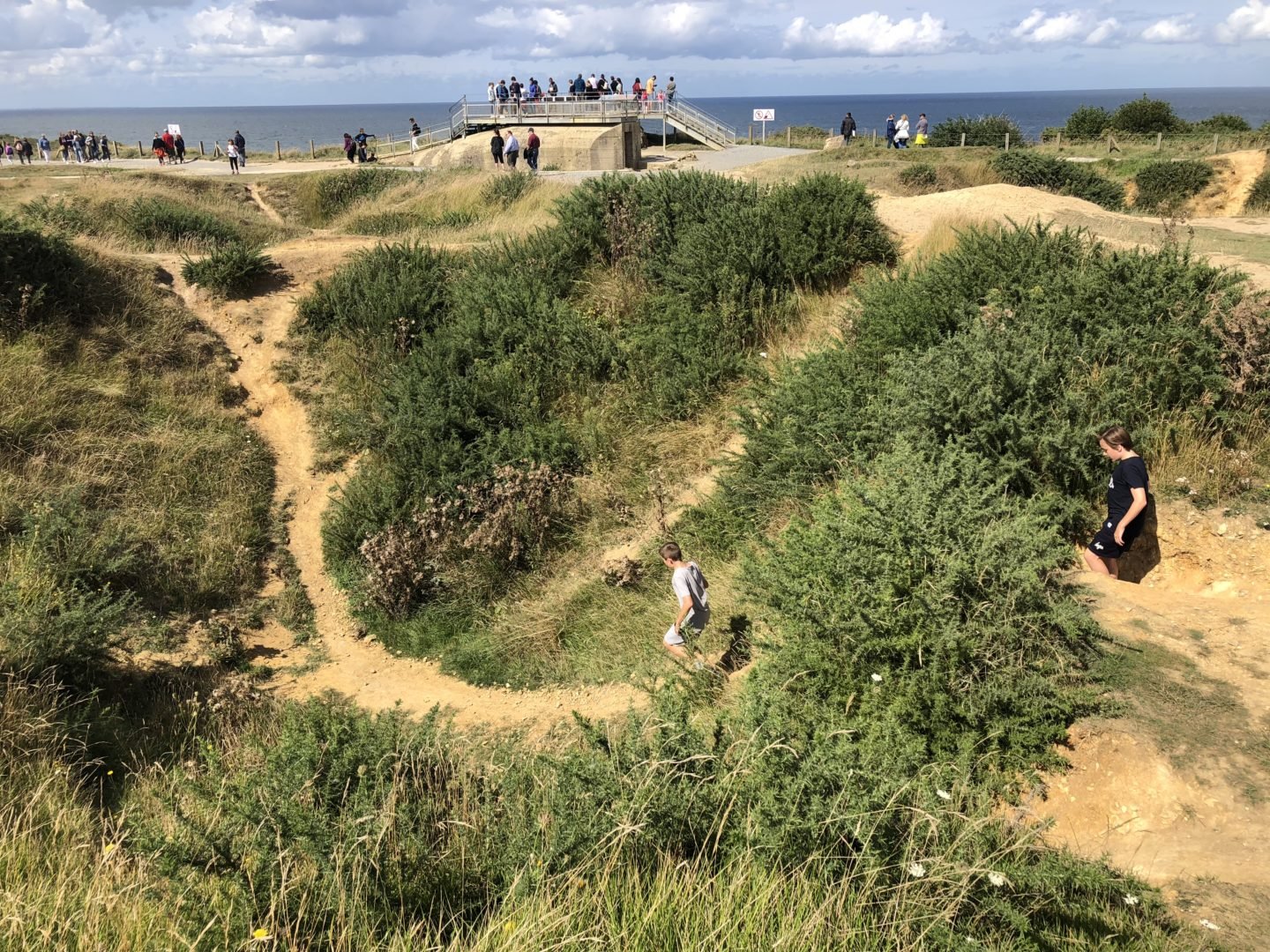 One Day Itinerary for the D day Normandy Beaches with Kids. Pointe du Hoc Bomb craters
