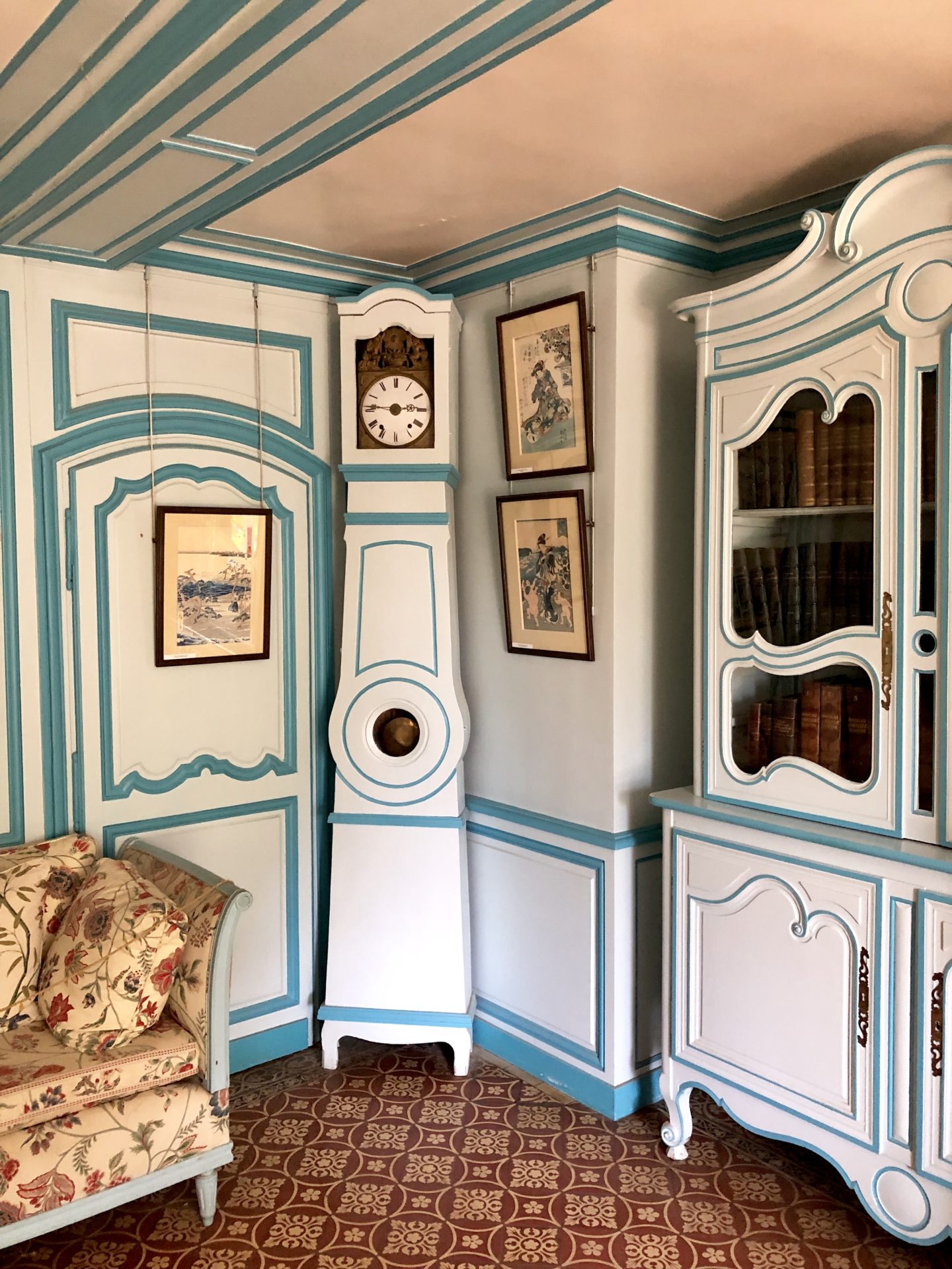 The Blue painted Grandfather clock and furniture in the little blue sitting room in Claude Monets house 