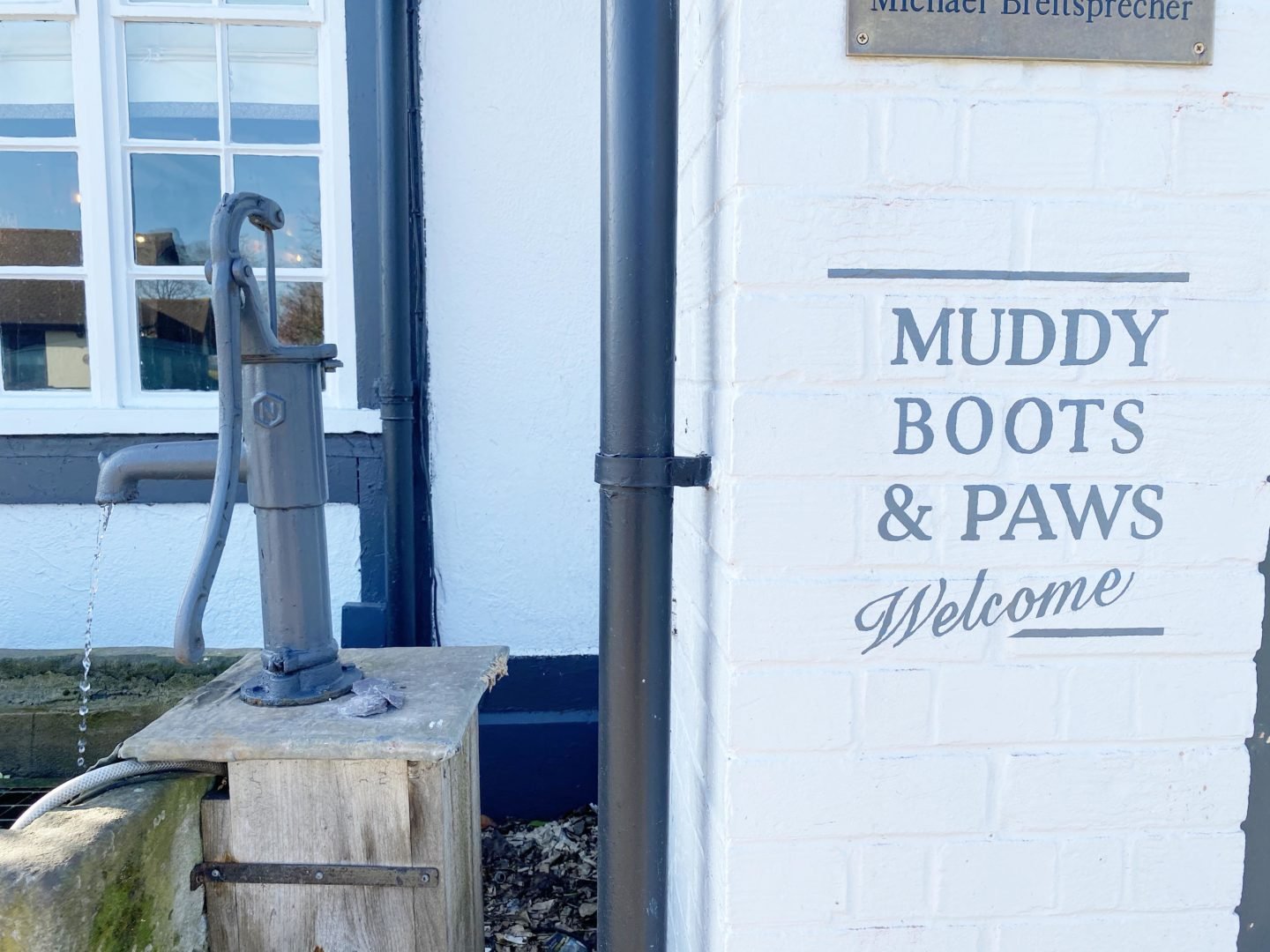 Dogs are welcome at the kings Head Pub to sit in the lounge area. Muddy boots and paws welcome sign