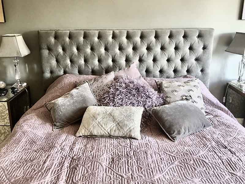 grey and lilac theme bedroom and velour headboard interior design
