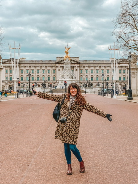 Buckingham palace London Woman standing in front