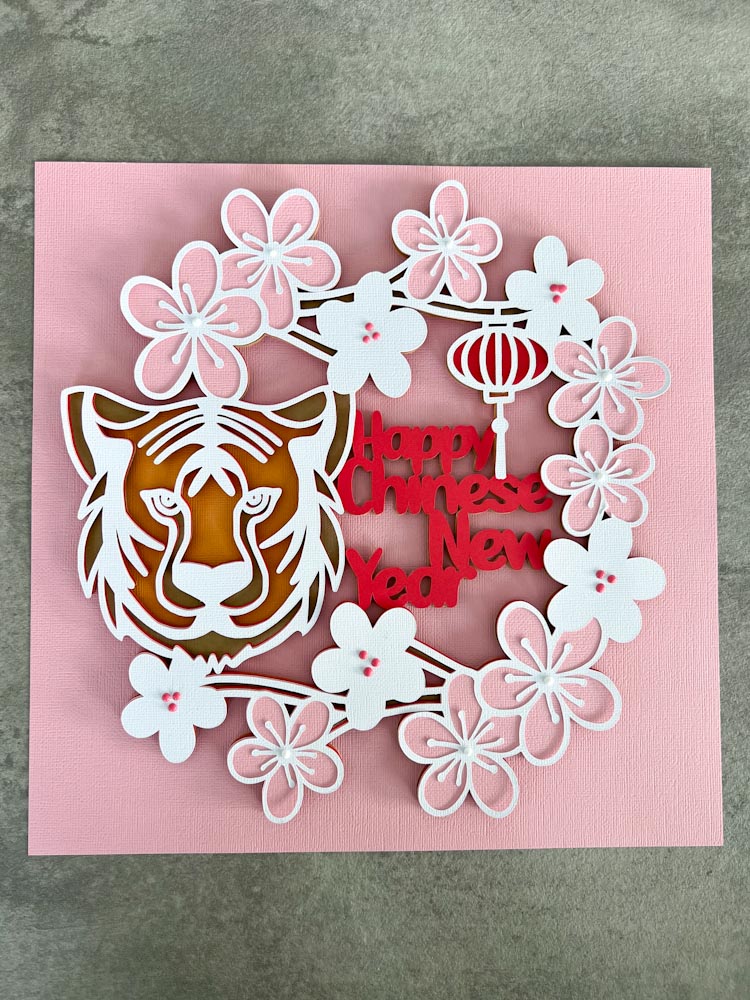 This Chinese New Year SVG wreath cut file can also be used for a  scrapbooking cut file for your celebration photos. Just use the top layer or e few layers and add a photo.