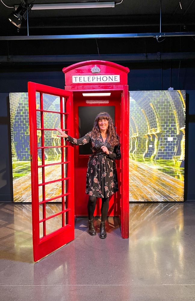At the end is a Ministry of Magic red phone box in photo exhibit London