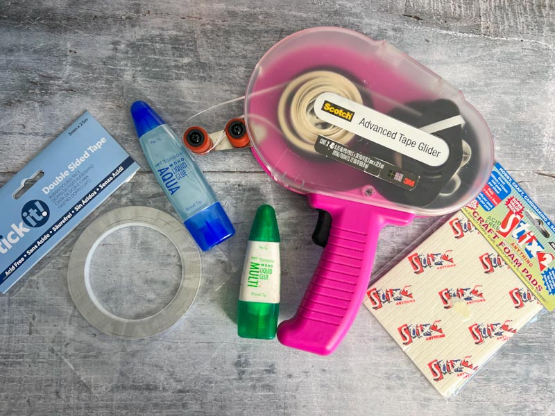 A mix of adhesives and glues used for scrapbooking