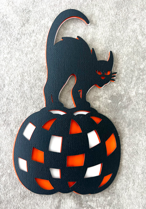 Halloween black cat on pumpkin SVG